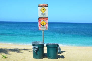 Beach hazard signs and dustbins