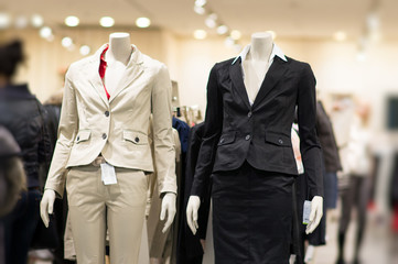 Black and white suits on mannequins in mall