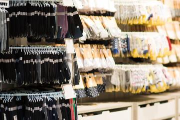 Variety of socks on stands in mall