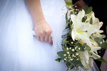Wedding bouquet in her hand the bride