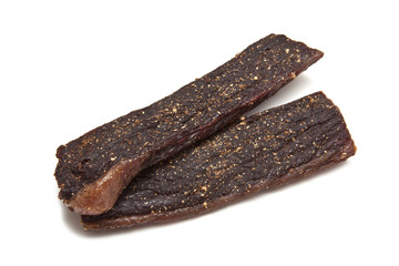South African biltong (beef) isolated on a white background