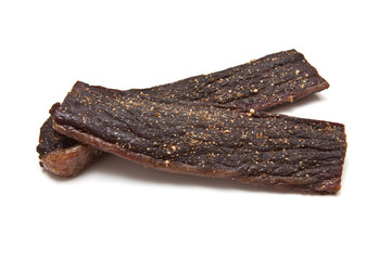 South African biltong (beef) isolated on a white background