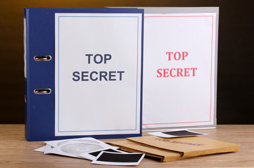 Envelopes and folders with top secret stamp and photo papers