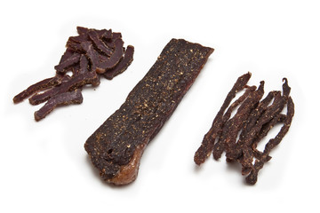 South African biltong strips  isolated on a white background