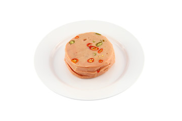 Pork bologna stack with chili dish on white background.