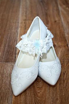 White shoes and bridal garter