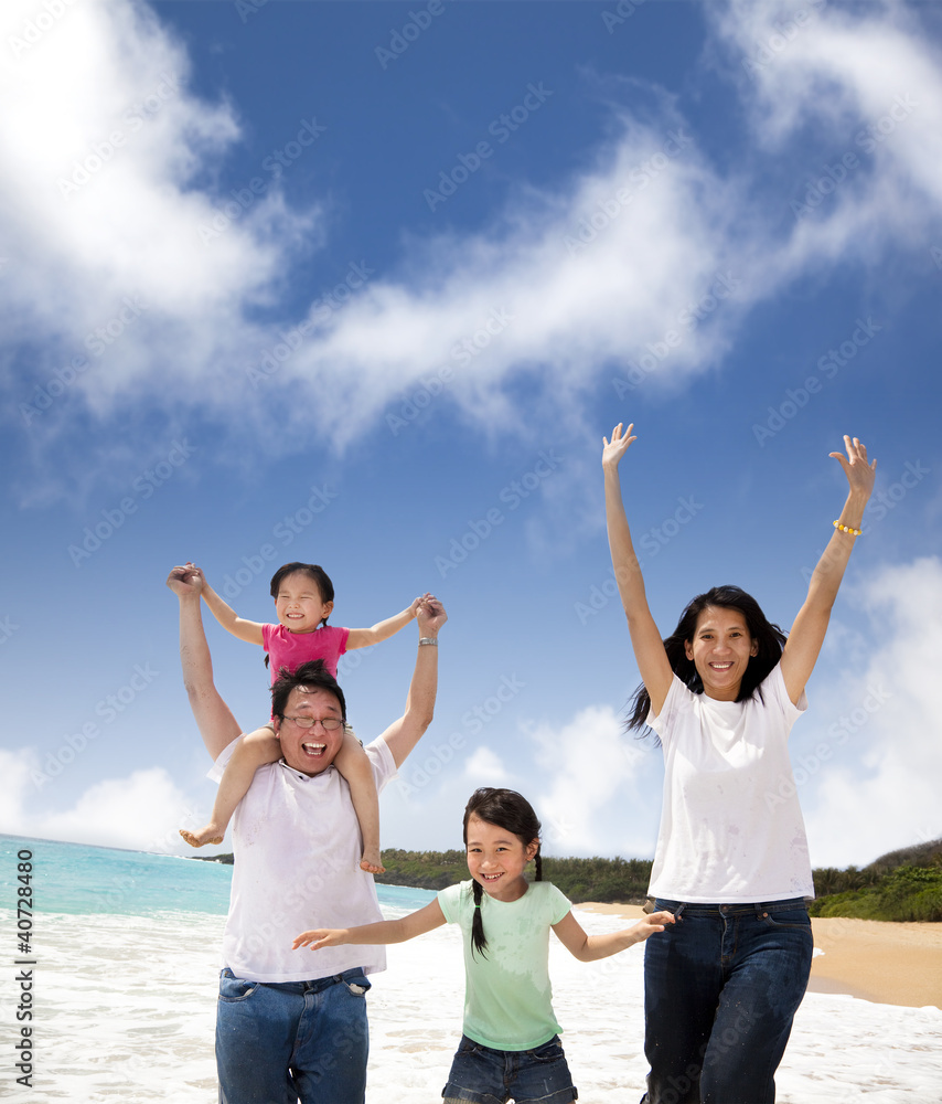 Wall mural happy family on the beach