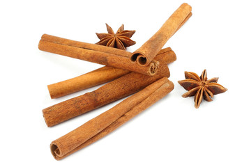 Cinnamon sticks and anise on white background