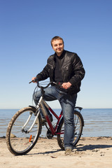 Cyclist at sea.