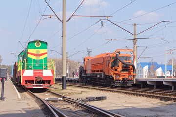 Fototapeta premium The multicolored diesel train and Railway heavy duty machines tr