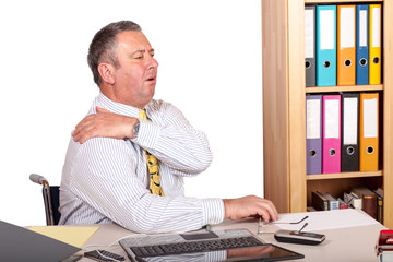 Man in office with shoulder pain