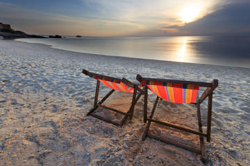 Fototapeta na wymiar couples chairs beach and sunset