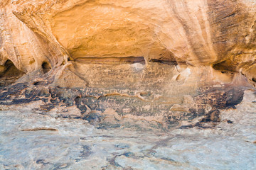 Petroglyphs on sandstone rock in Wadi Rum dessert