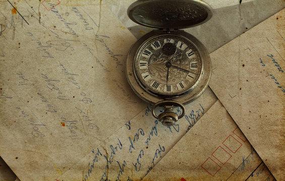 antique pocket watches and old letters