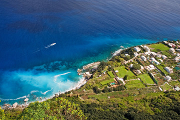 coastline with boat on capri island, italy