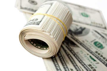 Rolled money cutout on a background dollars.