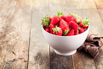 Strawberries on brown wooden table