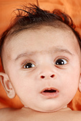 Baby boy with orange background