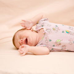 close-up portrait of crying newborn