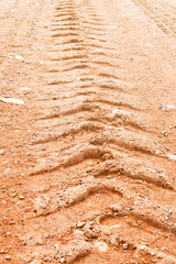 close-up trace of the car wheels on the sand