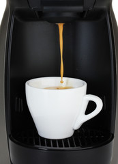 Espresso machine pouring coffee in white cup