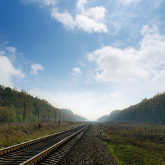 Fototapeta na wymiar railroad in fog to horizon