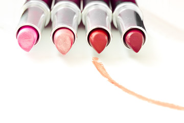 set of aligned lipsticks with red stroke