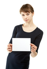 Young woman holding blank sheet of paper