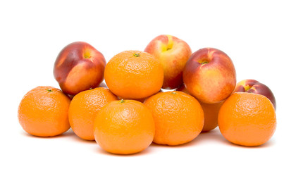 tangerines and nectarines on white background