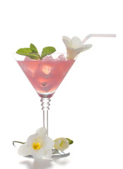 martini glass of cocktail with ice and flowers isolated on white