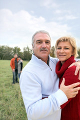 Obraz premium Two generations stood in field