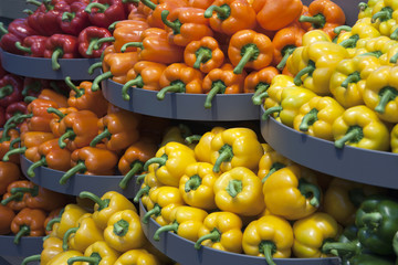 Piles of red, orange, yellow and green peppers
