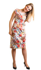 Blond woman in dress isolated on white
