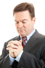 Stock Photo of Businessman Praying