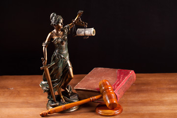 judge gavel Temida statue and law book