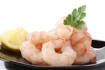 Pile of prawns over a black dish