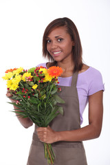 Young florist with bouquet