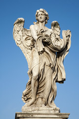 Fototapeta na wymiar Rome - Angel with garment and dice