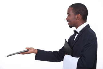 Profile of a waiter with a menu