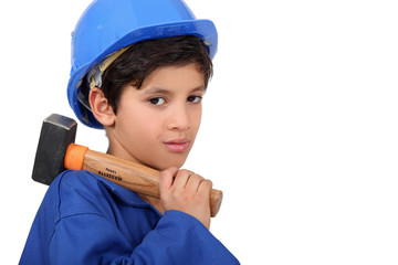 little boy dressed as a craftsman holding a hammer