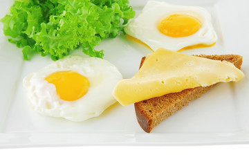 green lettuce and fried eggs