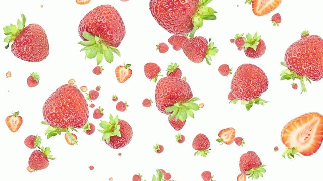 Strawberries falling down on white background