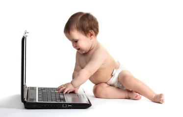 Cute baby girl and laptop isolated on white