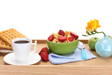 light breakfast on wooden tray isolated on white