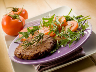 soy steak with arugua and tomatoes salad