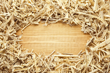 Wooden sawdust and shavings background with space for text