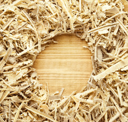 Wooden sawdust and shavings background with space for text