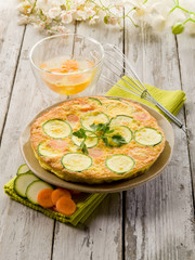 whole omelette with carrot zucchinis and parsley