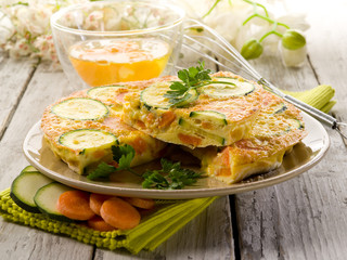 omelette with carrot zucchinis and parsley