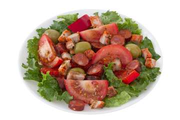 salad with meat and olives on the plate